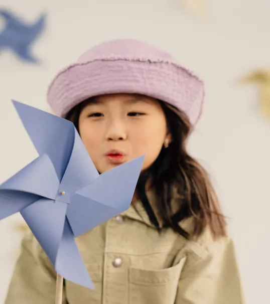 girl with blue pinwheel